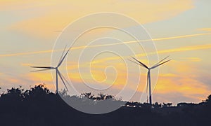 Wind turbines running at sunset in La Puebla de GuzmÃÂ¡n, Huelva, Andalusia, Spain.