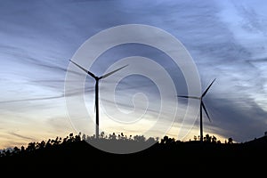 Wind turbines running at sunset in La Puebla de GuzmÃÂ¡n, Huelva, Andalusia, Spain.