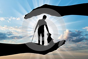 Silhouette of a blind disabled man with a cane in his hand and a dog guide