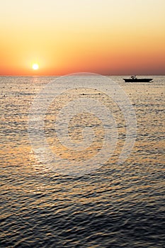 Silhouette boat with beautiful sunrise