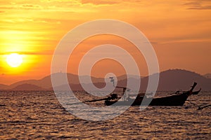 Silhouette of a Boat floating during sunset