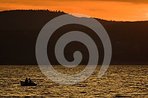 Silhouette Of Boat On The Lake