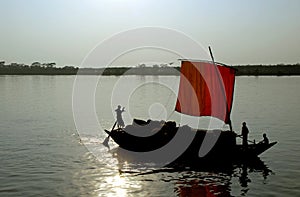 Silhouette of a boat on the Rupsa River near Mongla in Bangladesh