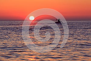 The silhouette of a boat at the sunset near Veliki Brijun island