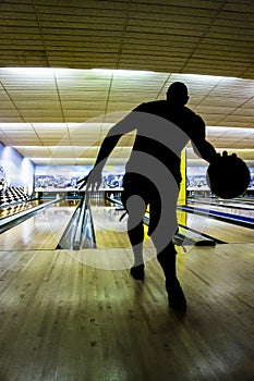 Silhouette of a bowling player