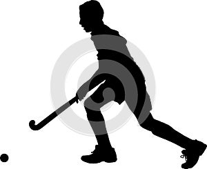 Silhouette of boy hockey player running with ball