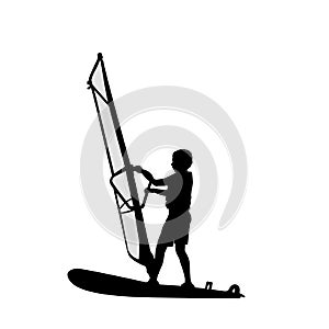 Silhouette boy learning to windsurf. Windsurfing water sport