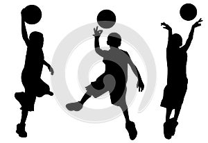 Silhouette of boy playing basketball