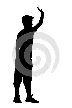 Silhouette of a boy stands