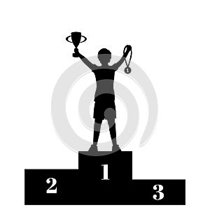 Silhouette boy winner of competition with cup and medal on the pedestal. Victory celebration.