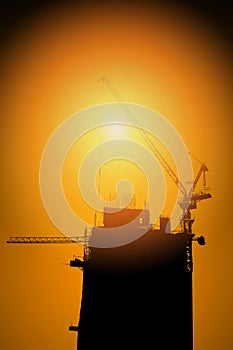 Silhouette Building construction site with cranes