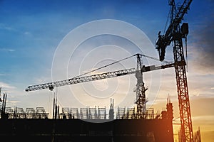 Silhouette building construction site in sunset