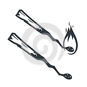 Silhouette of a burning match with flame