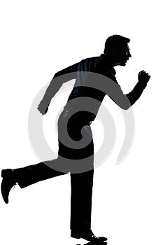 Silhouette business man running full length