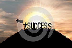 Silhouette business man standing and holding flag with success wording on the top of mountain, business success and achievement