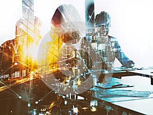 Silhouette of business people work together in office. Concept of teamwork and partnership. double exposure with network