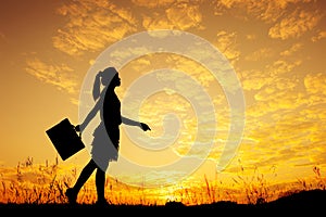 Silhouette of Business woman standing and sunset silhouette
