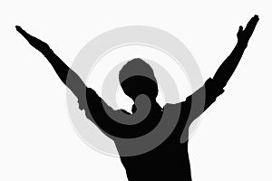 Silhouette of businessman with arms raised.