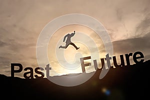 Silhouette of businessman glowing jump past to future. success c