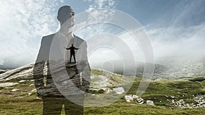 Silhouette of businessman with landscapes on background, double exposure.