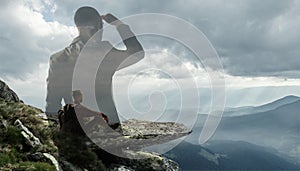 Silhouette of businessman with landscapes on background, double exposure.