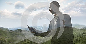 Silhouette of businessman with landscapes on background, double exposure.