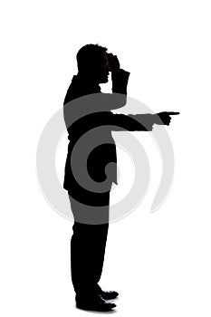 Silhouette of a Businessman Pointing Forward