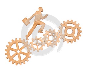 Silhouette of a businessman with a portfolio going to success through a set of gears.