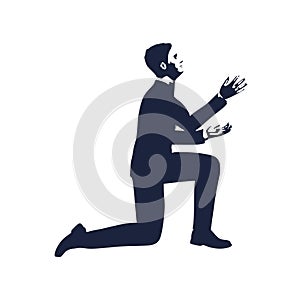 Businessman in prayer pose.