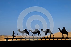 Silhouette of camel caravan