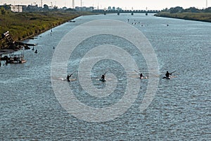 Silhouette of Canoes Competition on the River