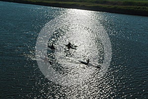 Silhouette of Canoes Competition on the River