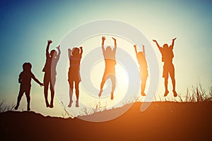 Silhouette of children jump gladness happy time