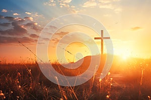 silhouette christian cross on grass in sunrise