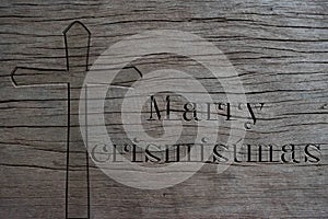 Silhouette of Christian cross on old wood background