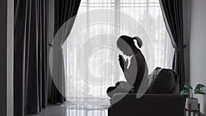 Silhouette of christian woman hand praying, spirituality and religion, woman praying to god. Christianity concept. Freedom and