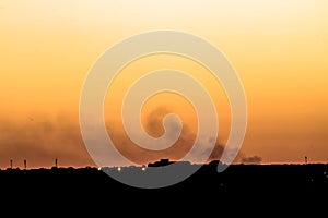 Silhouette of cityscaper buildings during a sunset