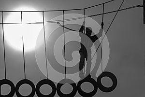 Silhouette of a climber holding ropes