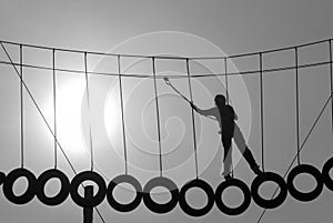 Silhouette of a climber holding ropes