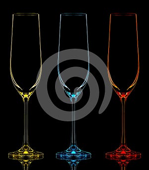 Silhouette of color champagne glass on black