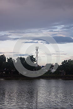 Silhouette communication tower telecoms at sunset