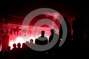 Silhouette of concert crowd and stage lights