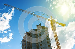 Silhouette construction crane equipment,Industrial construction crane and building over amazing sunset sky abstract