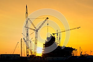 Silhouette of construction site in sunset time