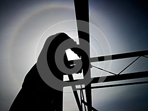 Silhouette of a construction worker working under hot sun