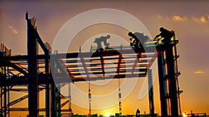 Silhouette of Construction Workers at Dusk