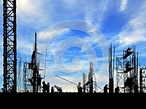 Silhouette construction workers group are working in construction site