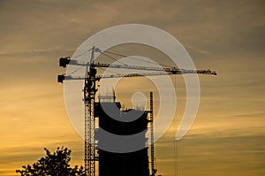 Silhouette, contruction, crane, at, sunrise