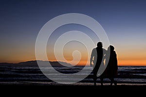 Silhouette of a couple on the beach