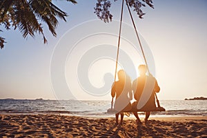 Silhouette of couple on the beach, romantic vacation